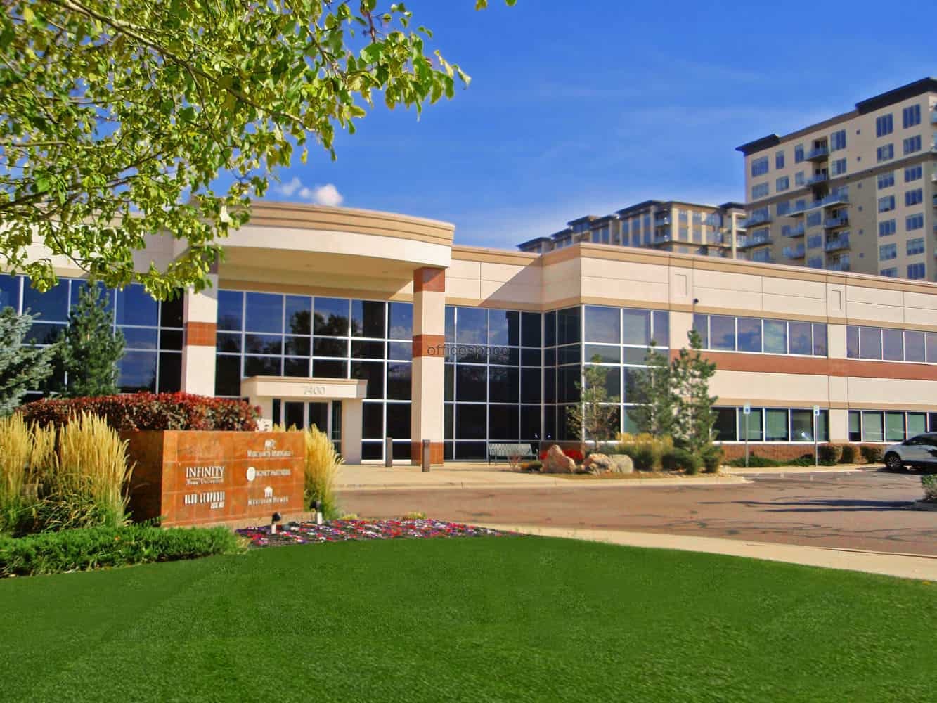 A large office building with grass in front of it, near Dentevita Prosthodontics in Denver.